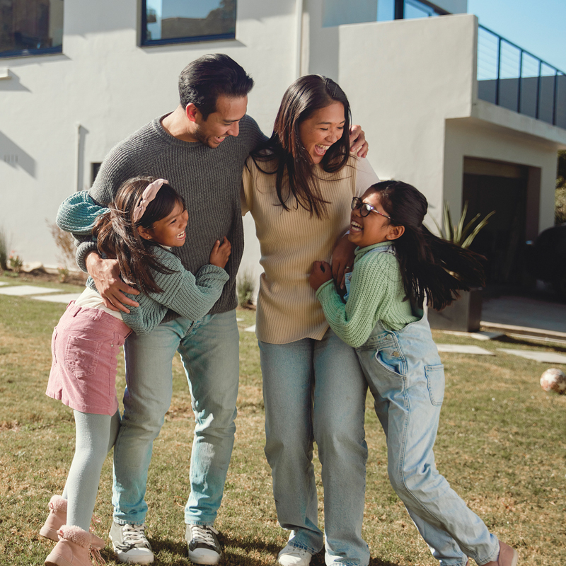 Family in front of new home in Birmingham, AL